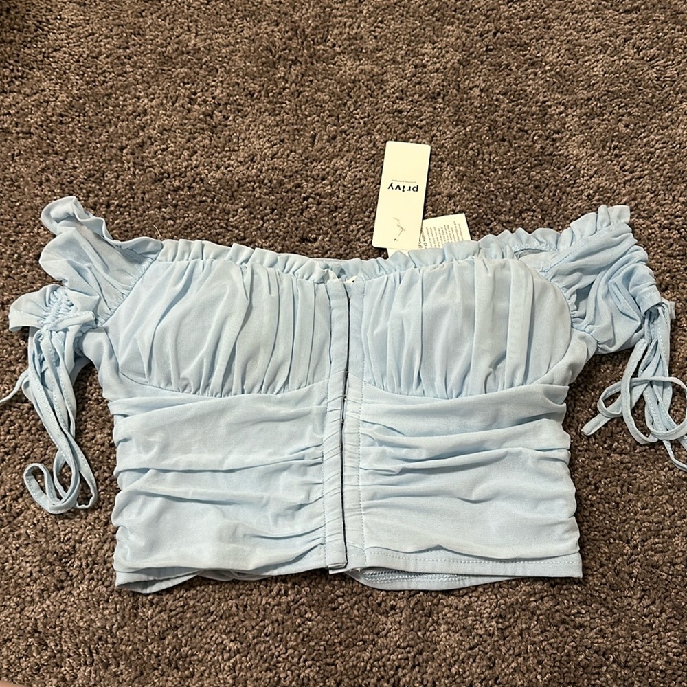 Blue off shoulder cropped top